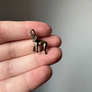 Tiny delicate brass elephant pendant
